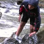 Ian navigating his way across the stream.