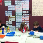 Jeremy, Callie, and Lucas read math books