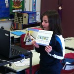 Toula reads "Ella's Time Line"