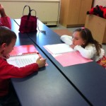 Lucas reads his poems while Meghan also listens
