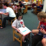 Toula reads her book